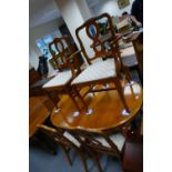 French style walnut dining table with shaped freeze and 6 matching chairs including one carver. (7)