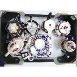 A collection of Imari style earthen ware items to include pewter lidded jugs, tea pots, saucers,