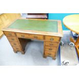 Late Victorian leather topped 9 drawer walnut desk.