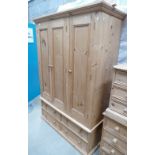 Modern pine 3 door wardrobe with 4 drawers to base