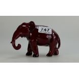 Royal Doulton flambe model of small elephant with trunk down, height 10cm (slight glaze fault to end