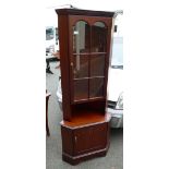 Reproduction Mahogany corner cupboard with single door.