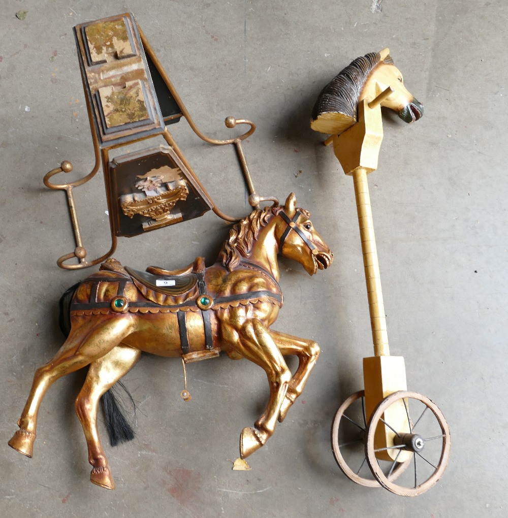 A gilt decorated reproduction rocking horse and reproduction hobby horse. (2)