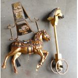 A gilt decorated reproduction rocking horse and reproduction hobby horse. (2)