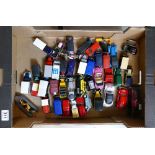 A collection of die cast and plastic model cars and vans to include VW Beetles, advertising vans,