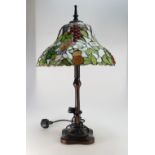Large Tiffany style leaded glass table lamp on bronzed base.