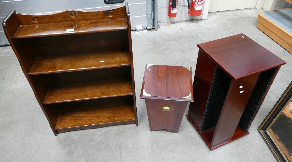 A reproduction oak four tier side unit with a reproduction revolving CD rack and a mahogany coal