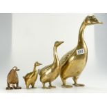 A collection of graduated brass ducks together with similar wooden item. (4)