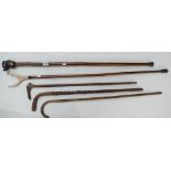 A collection of early walking sticks and rests (5)