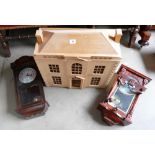 A two floor dolls house and two reproduction wall clocks. (3)