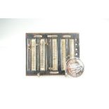 Vintage knitting gauge and silver commemorative United States 2001 coin in plastic case (2)