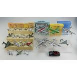 A collection of toy Dinky model aircraft that have been painted and repackaged in reproduction