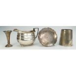 A collection of hallmarked silver items to include christening mug, milk jug,