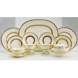 A large collection of Minton Gilt decorated dinnerware in the K100 pattern to include dinner plates,