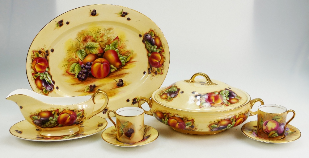 A collection of Aynsley Orchard Gold dinnerware items to include coffee cans, tureens,