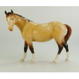 Beswick Mare in dun facing left,