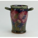 William Moorcroft Burslem two handled vase decorated in the Pomegranate design on ochre ground,
