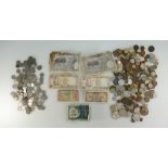 A collection of old bank notes and various coins