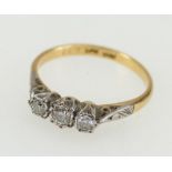 18ct gold three stone diamond ring, 2.