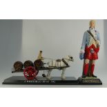 A large ceramic advertising figure of Prince Charlie for Drambuie together with plastic advertising