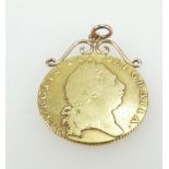 George III 22ct gold full guinea coin 1798, with yellow metal mount. 8.8 grams total.