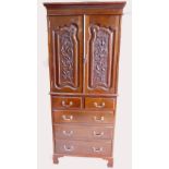 Edwardian carved walnut two door cupboard on chest,