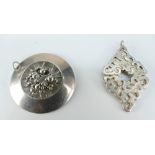 Silver art nouveau style round pendant and a silver shaped pendant (2)
