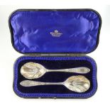 Pair ornate silver spoons hallmarked for London 1903 in original box by H Pidduck & sons,