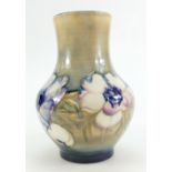 William Moorcroft Clematis Vase, early version of the design on Ochre Ground, height 17cm.