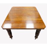 Edwardian large oak extending dining table with two extra leaves and winding handle,
