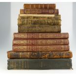 A collection of antique leather books including,