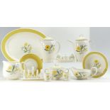 A collection of Susie Cooper hand decorated dinner ware in the Marigold design to include cruet