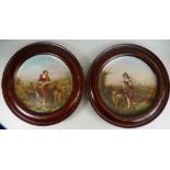 Pair of English pottery circular plaques signed J Rouse,