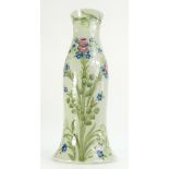 William Moorcroft Macintyre funnel vase decorated in the Forget-Me-Knots design on pale green