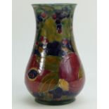 William Moorcroft Burslem vase decorated in the Pomegranate design on ochre ground, dated 1914,