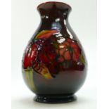 Walter Moorcroft Flambe vase decorated in the Orchid design, height 15.5cm (tiny nick to base edge).