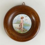 Minton plaque freehand painted with a cherub signed L Boullemier (Lucien Emile) mounted in an oak