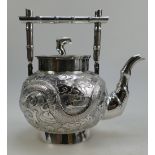 Chinese silver teapot with embossed and chased decoration circa 1900, makers mark N.M. Weight 476.