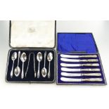 Set of silver spoons & tongs in original leather box,