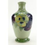 William Moorcroft Burslem vase decorated in the Pansy design on Celadon ground,