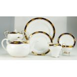 A collection of Aynsley Empress Cobalt tea and dinner ware items with raised gilt decoration to