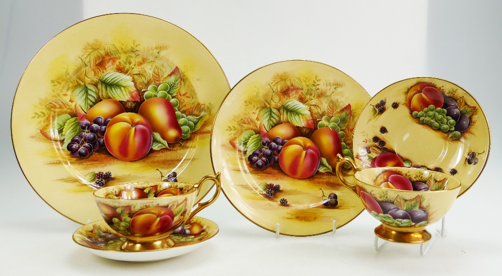 A collection of Aynsley Orchard Gold tea and dinnerware items to include dinner plates, side plates,