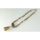 9ct gold part watch chain with black enamel decoration and attached gem set fob.