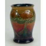 William Moorcroft Burslem vase decorated in the Eventide design, height 13.