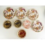 A mixed collection of Royal Crown Derby dinnerware and decorative wall plates in Olde Avesbury