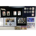 A collection of collectors coins including The Royal Mint 2010 coin set, Chinese silver dollars,