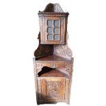 19th century carved oak Belgium corner cupboard with glazed two door top,