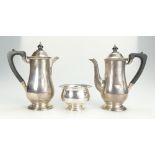 Silver coffee pot with ebony handle and lid hallmarked for Birmingham 1946 and matching water jug