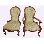 A good pair of Victorian shaped carved walnut ladies and gents arm chairs on cabriole legs (2)