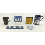 A collection of Wedgwood jasper items including black basalt mug decorated with a horses head,